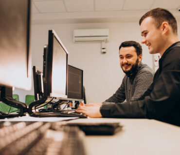 Young male web designers working on a computer